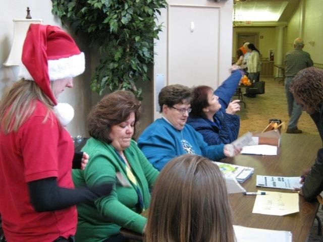 Volunteers Check in Participants