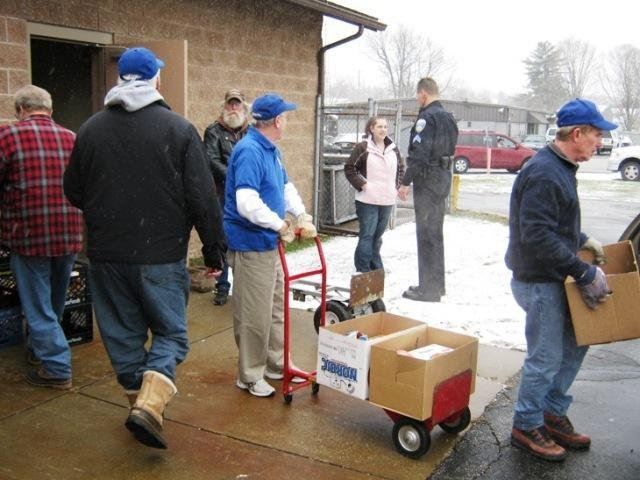 Volunteers Move Food on Carts