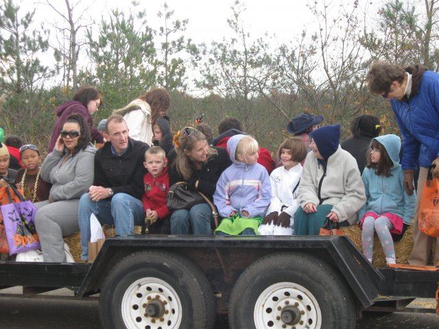 Families Ride on Hay Bale Ride