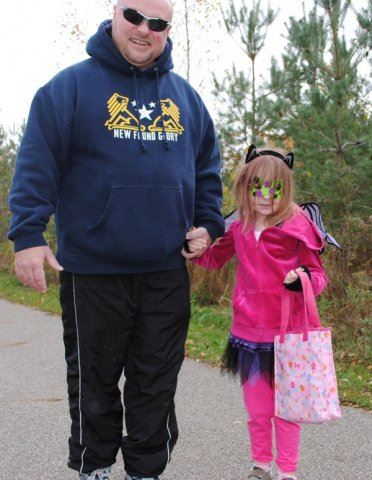 Young Girl and Father Smile Together