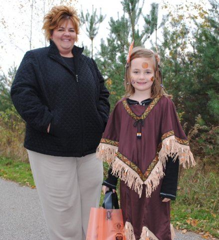 Young Girl in Costume With Mom