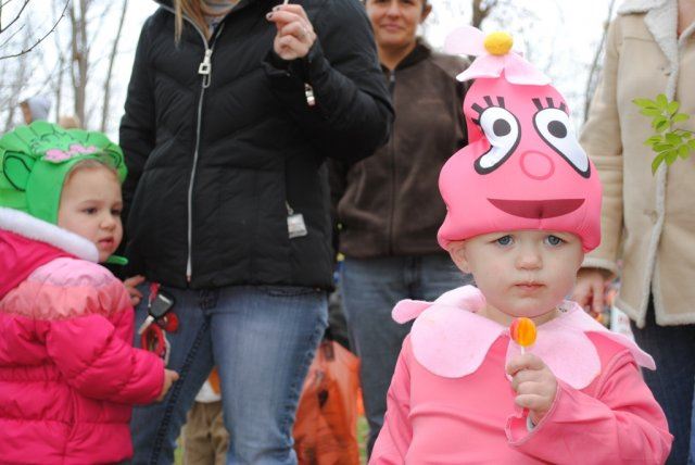 Young Girls in Pink Costuems Eat Candy