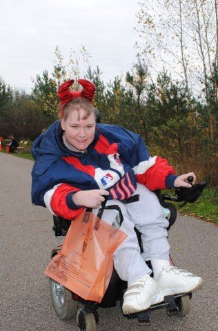 Young Person with Red Ears and Bag