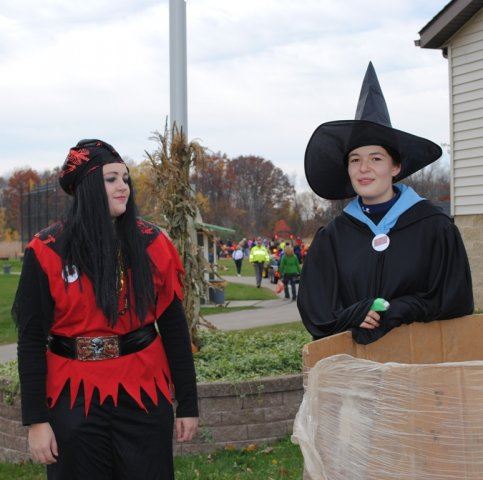 Young Volunteers in Costumes Wait for Activities