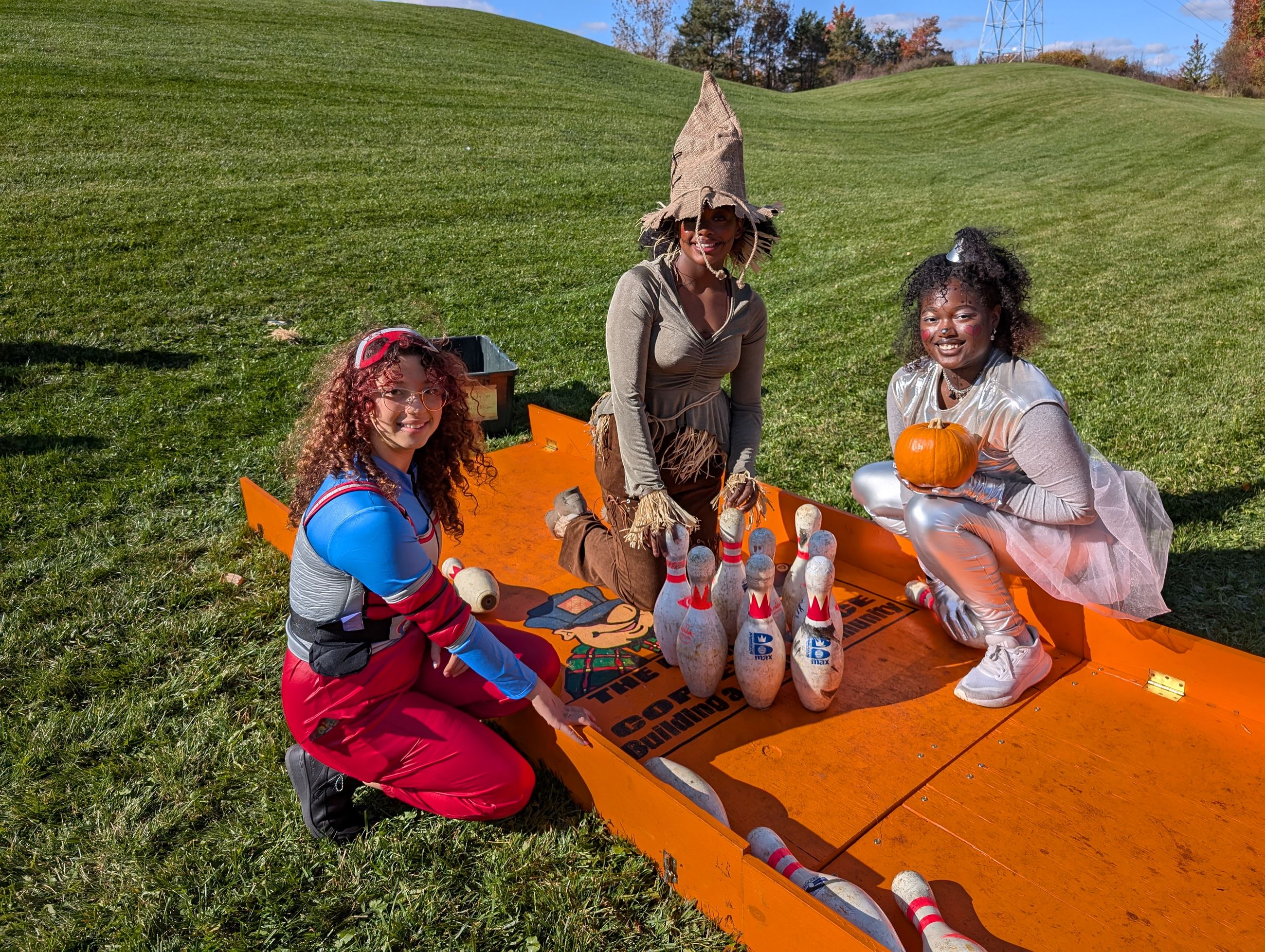 three volunteers bowling