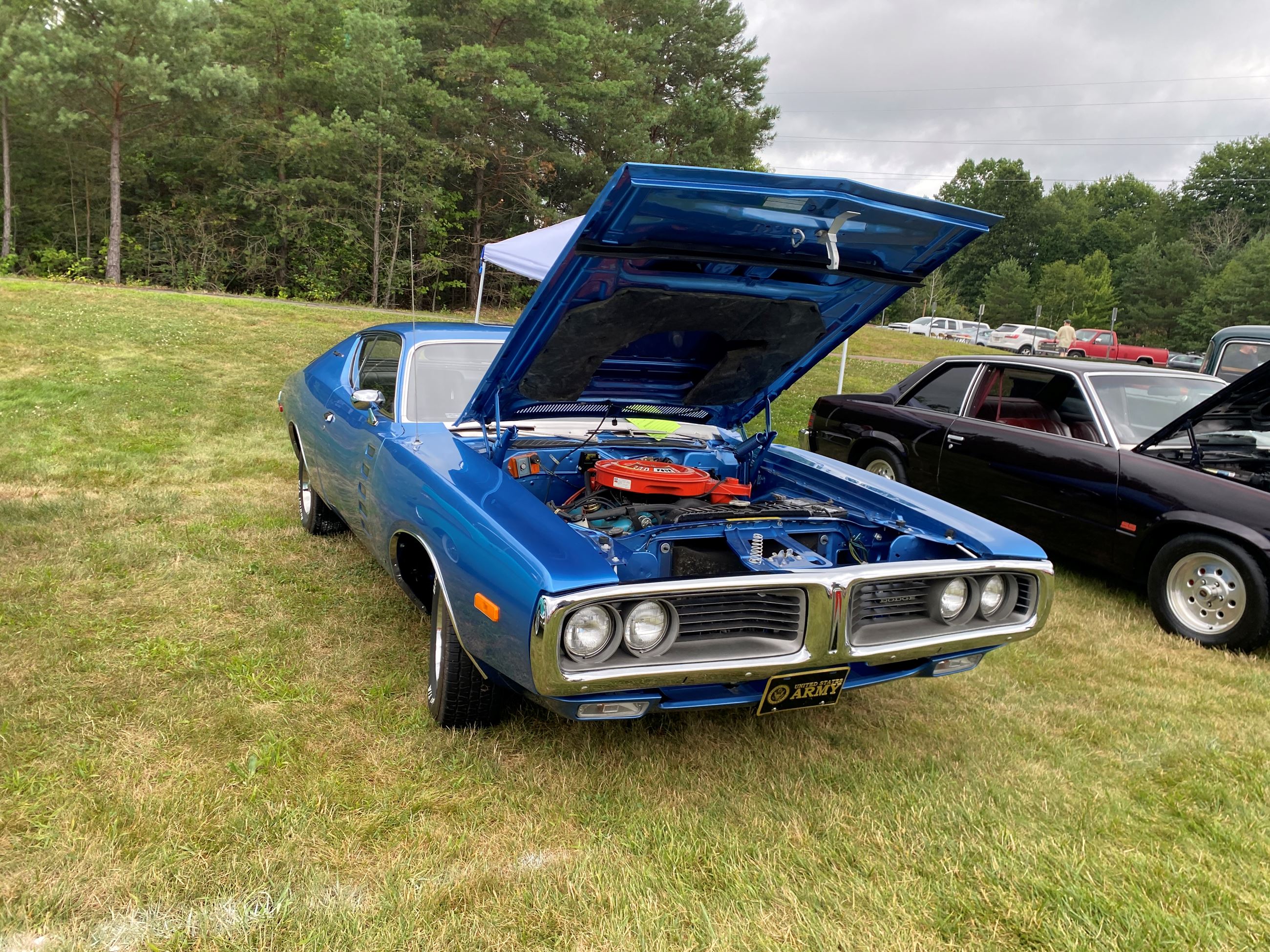 Vintage Blue Muscle Car On With It's Hood Open at Car Show 2025