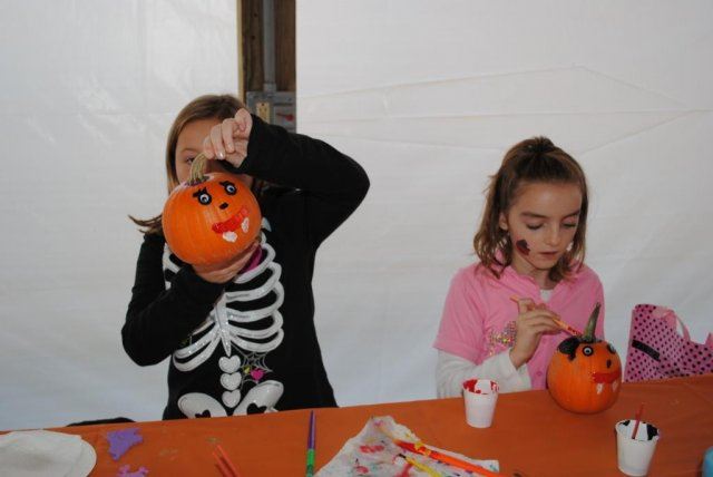 Young Children Paint Pumpkins