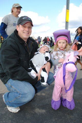 Young Cowgirl Takes Photo With Family