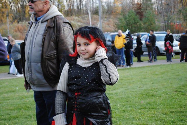 Young Girl in Red Wig Smiles