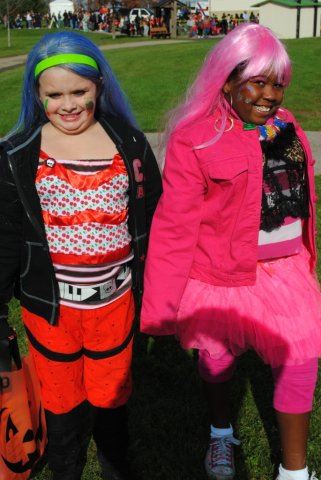 Young Girls Smile in Bright Costumes